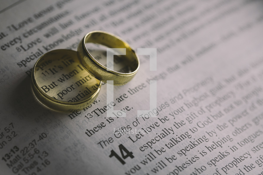 wedding bands on the pages of a Bible 