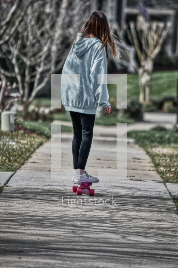 girl riding a skateboard 