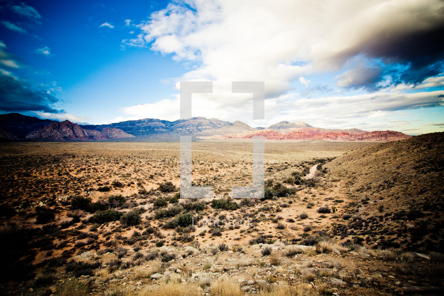 white clouds and blue sky over desert mountains in Nevada
