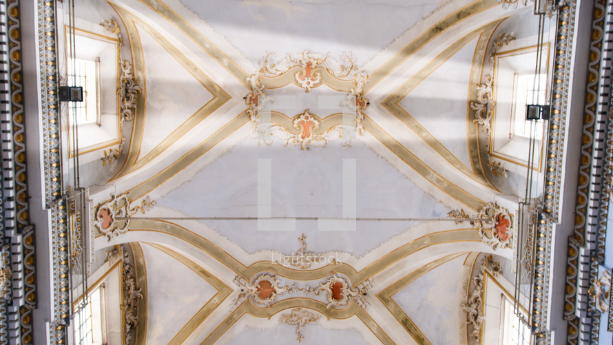 Ceiling with windows of a big majestic church cathedral in Italy