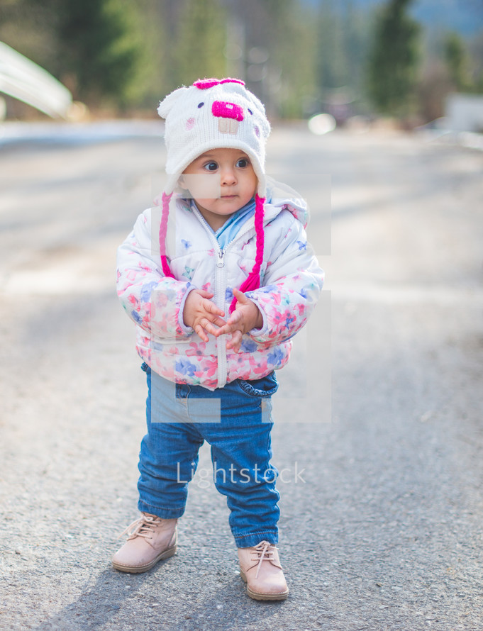 a toddler girl in a winter coat 