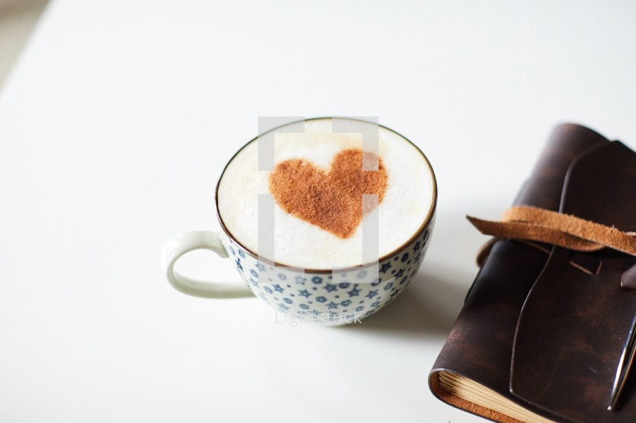 cinnamon heart in a coffee cup and Leather bound Bible 