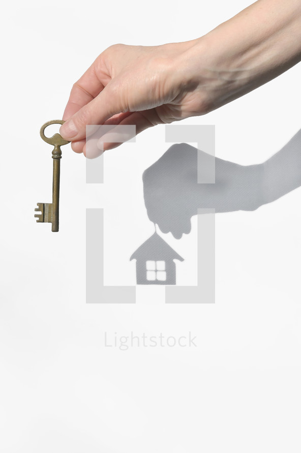 Abstract Real Estate Agent With House Key And House Shadow