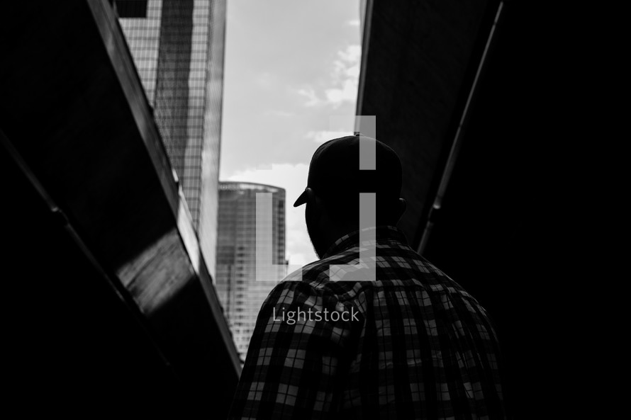 a man standing in a city 