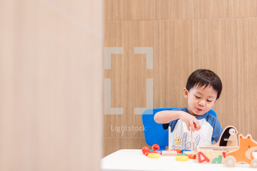 a toddler playing with toys 