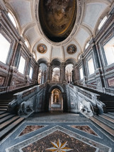 sumptuous marble staircases of a royal palace