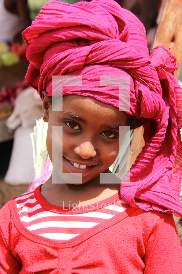 Young Ethiopian girl wearing a traditional head scarf 