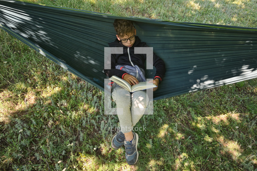 a boy in a hammock 