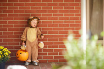 a child trick-or-treating on Halloween 