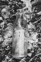 clear glass bottle in black and white 