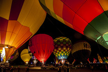 hot air balloon festival in the desert at night 