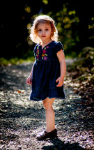 Girl on a gravel trail.