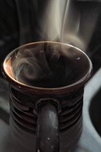 steam from a cup of coffee