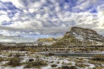 clouds roll over the desert buttes at Colorado State Park, James M. Robb Island acres state park on a winter day with the Colorado River running through it