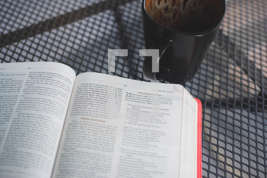 opened Bible and coffee cup 
