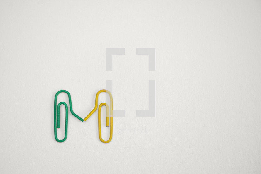 Concept Paperclips sign together on white background