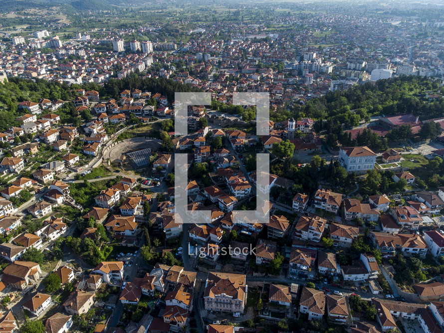 aerial view over a tile roof homes in a coastal community 