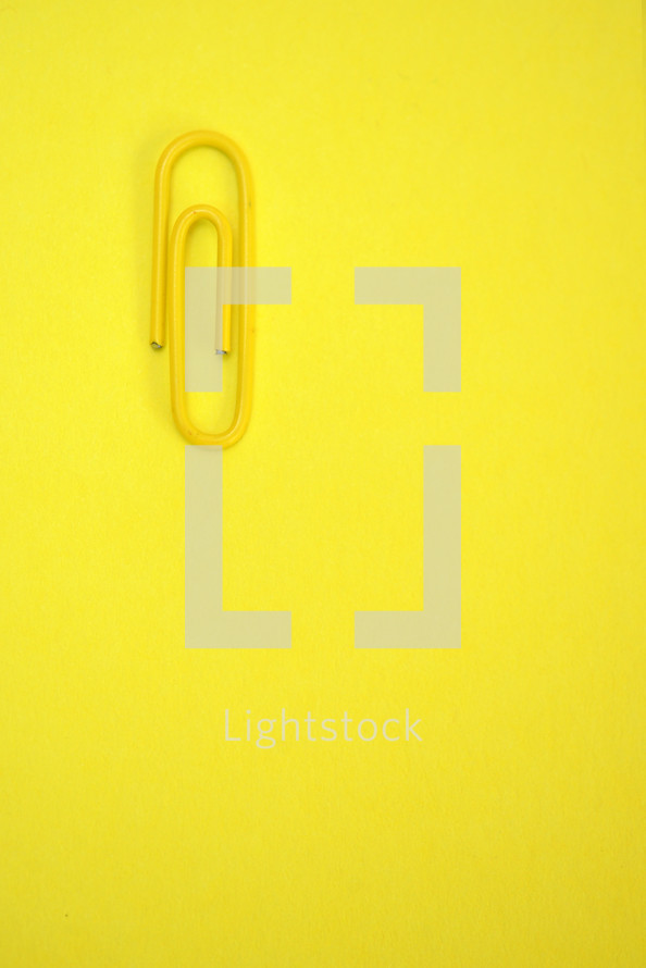 paper clip on yellow 