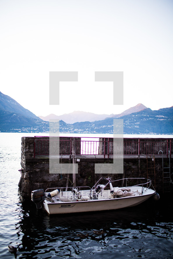 a docked boat on Lake Como 