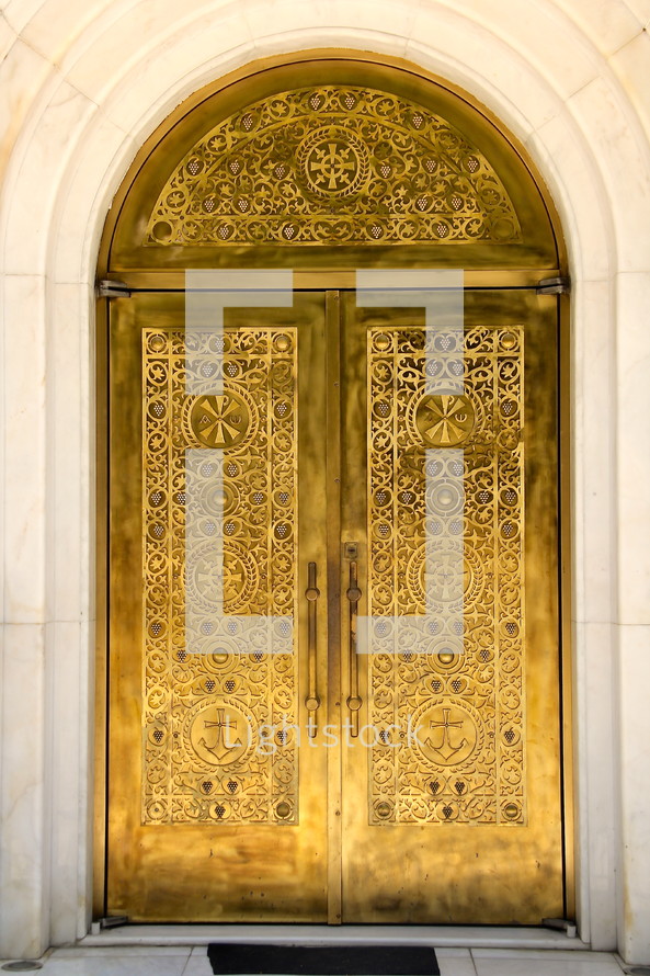 Golden church door with Albanian Orthodox church symbols