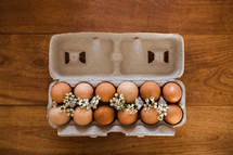 brown eggs in an egg carton 