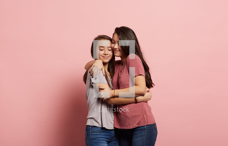 teen girls hugging 