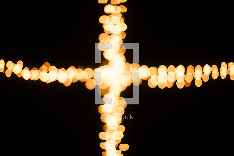 bokeh Christmas lights in the shape of a cross