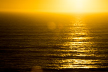 golden rays of sunlight over the ocean 