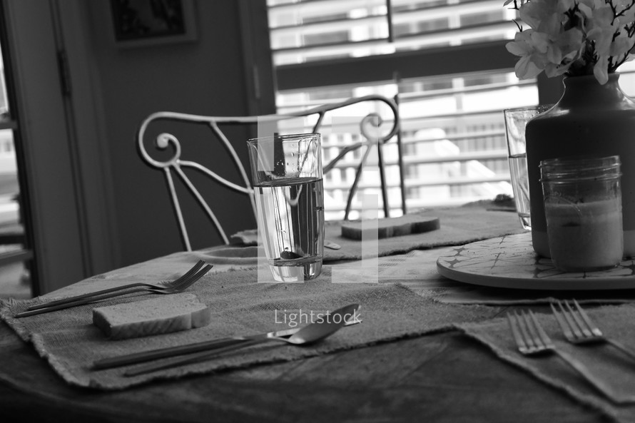 bread and water on a kitchen table 