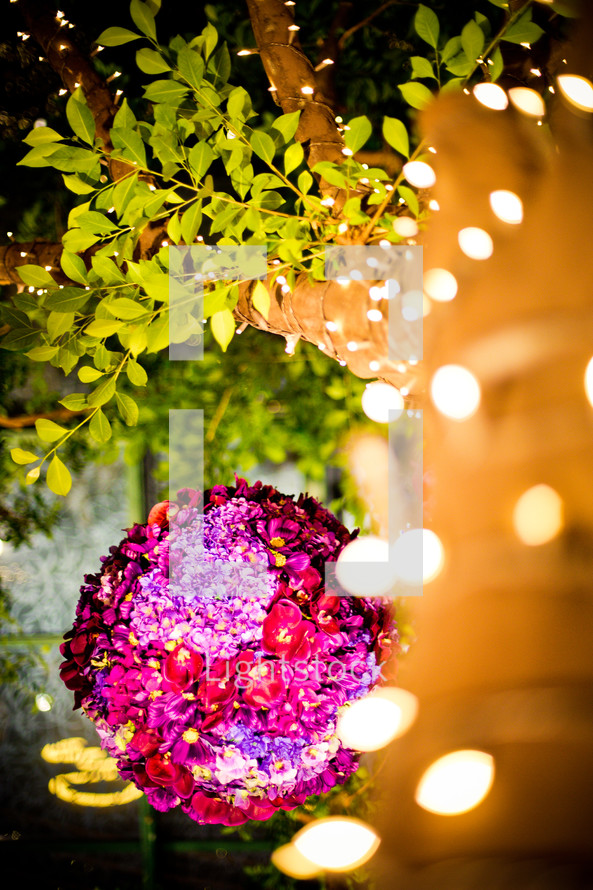 strands of lights and a decorative ball of roses