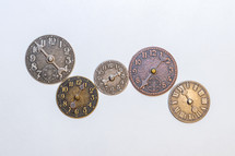 Several small metal clocks
