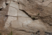 cracks in rocks on a cliff 