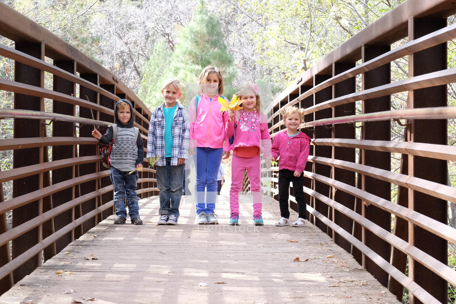 kids on a footbridge 