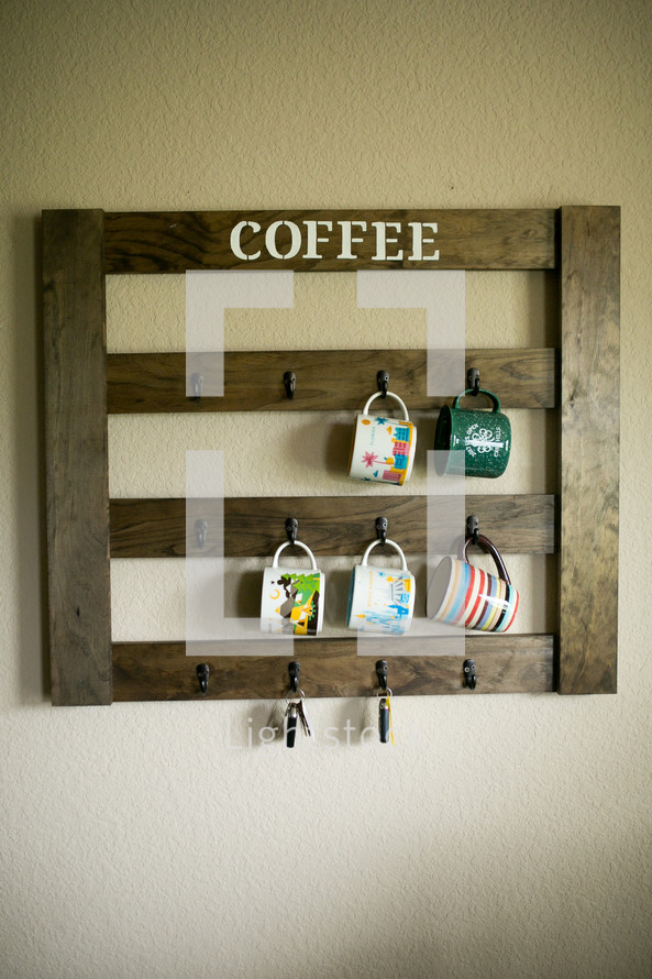 coffee cups hanging on hooks 