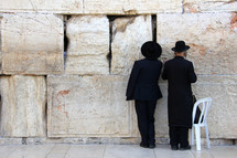 Men worshipping at the Wailing Wall/Western Wall in Jerusalem.