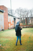 a girl carrying an umbrella 