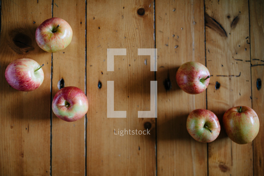apples on a wood table 