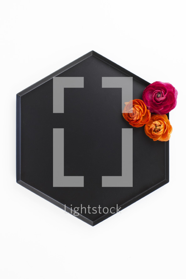 flowers on a black tray 
