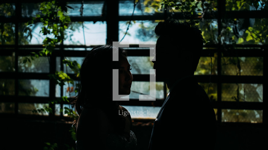 silhouette of a couple standing together 