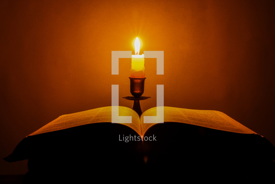 Candlelight photo of a Bible
