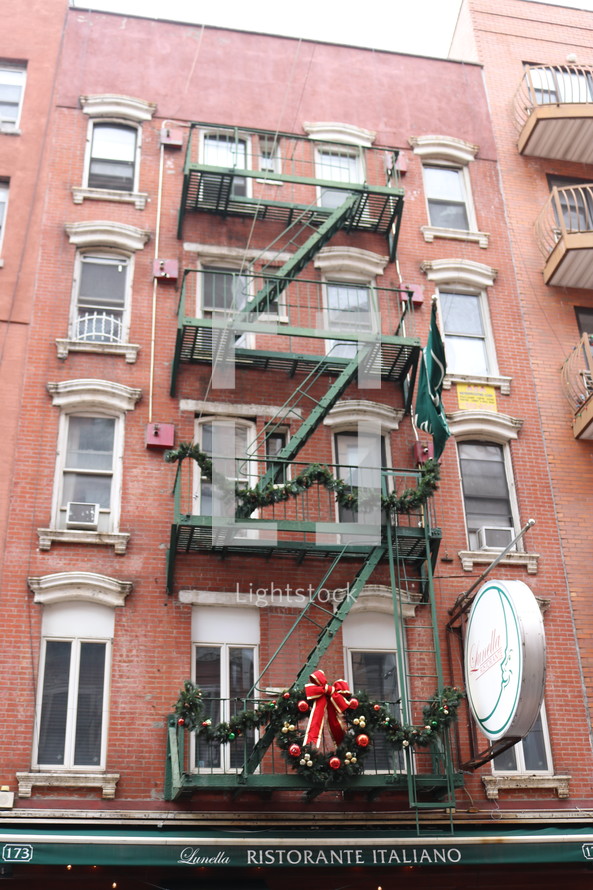 Christmas wreath on a fire escape 