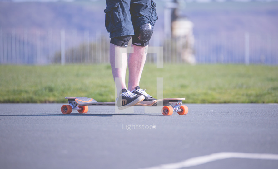 a teen boys feet on a skateboard 