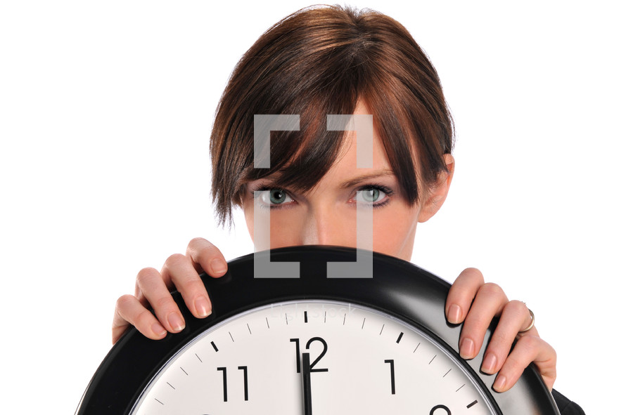 woman holding a clock 
