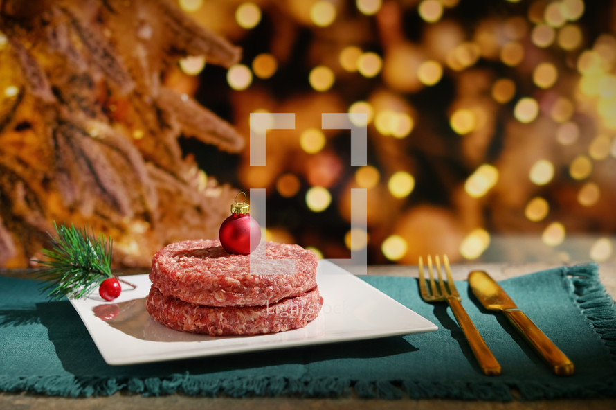 Meat patties with a Christmas bauble