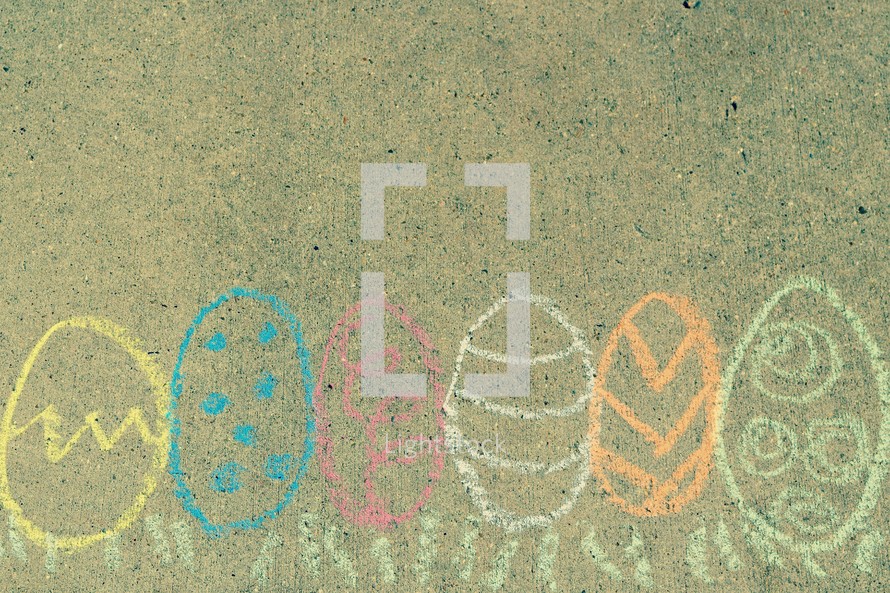 Border of Easter eggs in the grass in sidewalk chalk 
