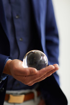 a man with a crystal ball 