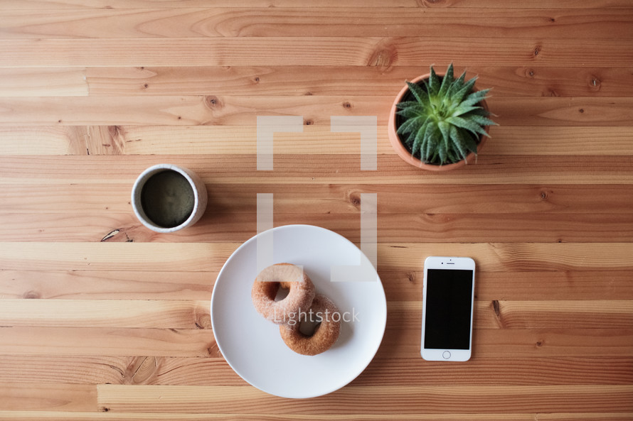 donuts and coffee on a table 
