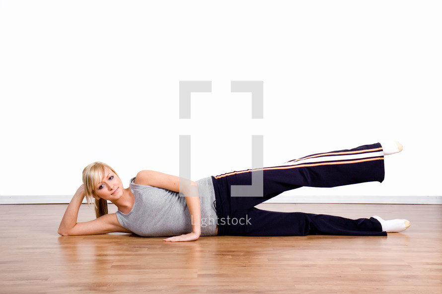  a young woman exercising 