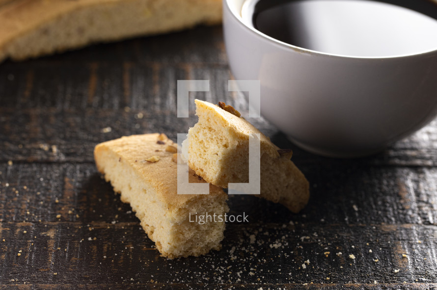 coffee and Almond and Walnut Biscotti Isolated on a Wood Background