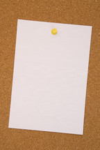 blank paper on a cork board 